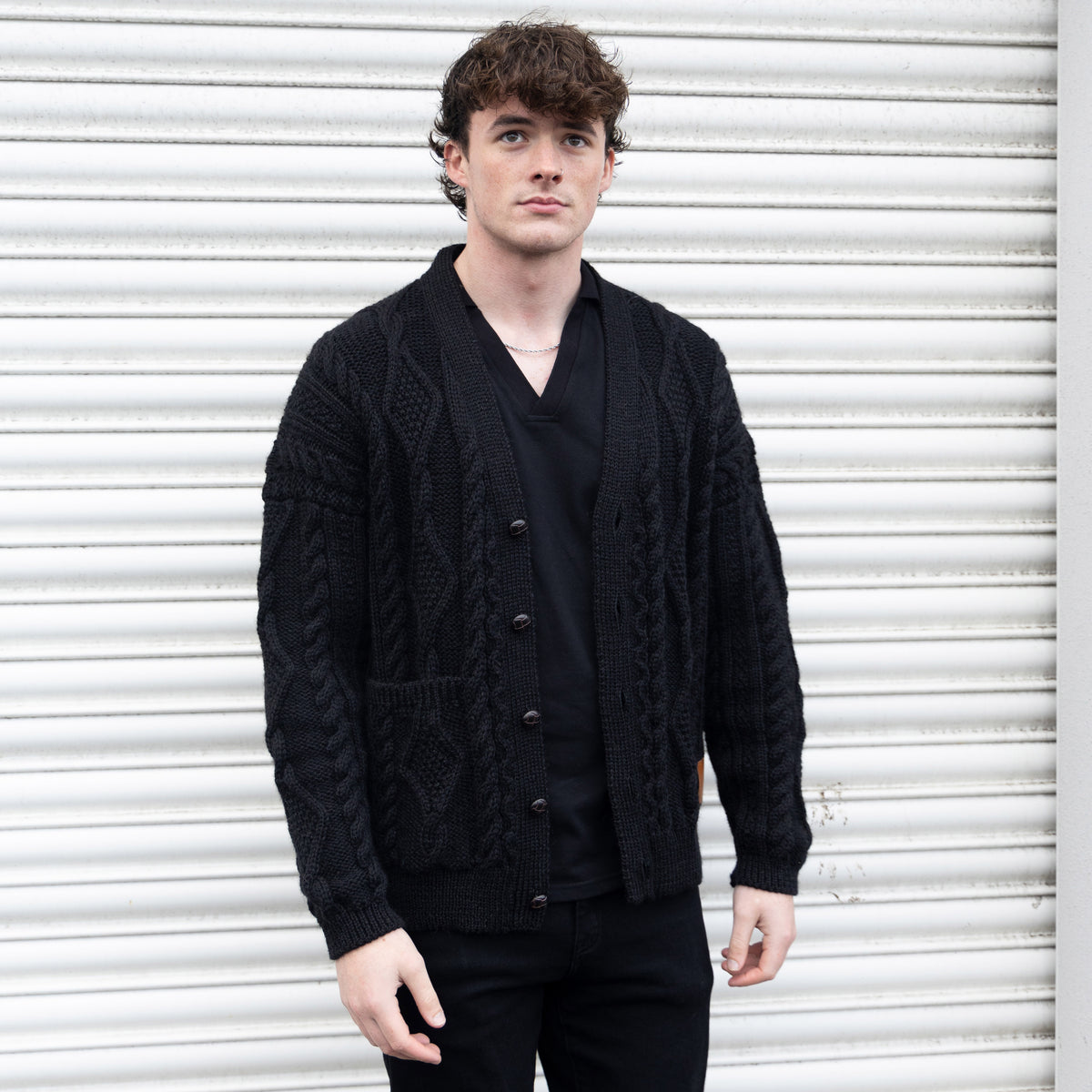 VG111B PURE WOOL ARRAN CARDI IN BLACK