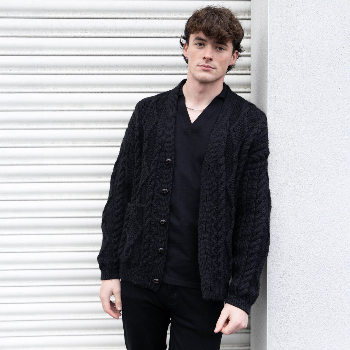 VG111B PURE WOOL ARRAN CARDI IN BLACK