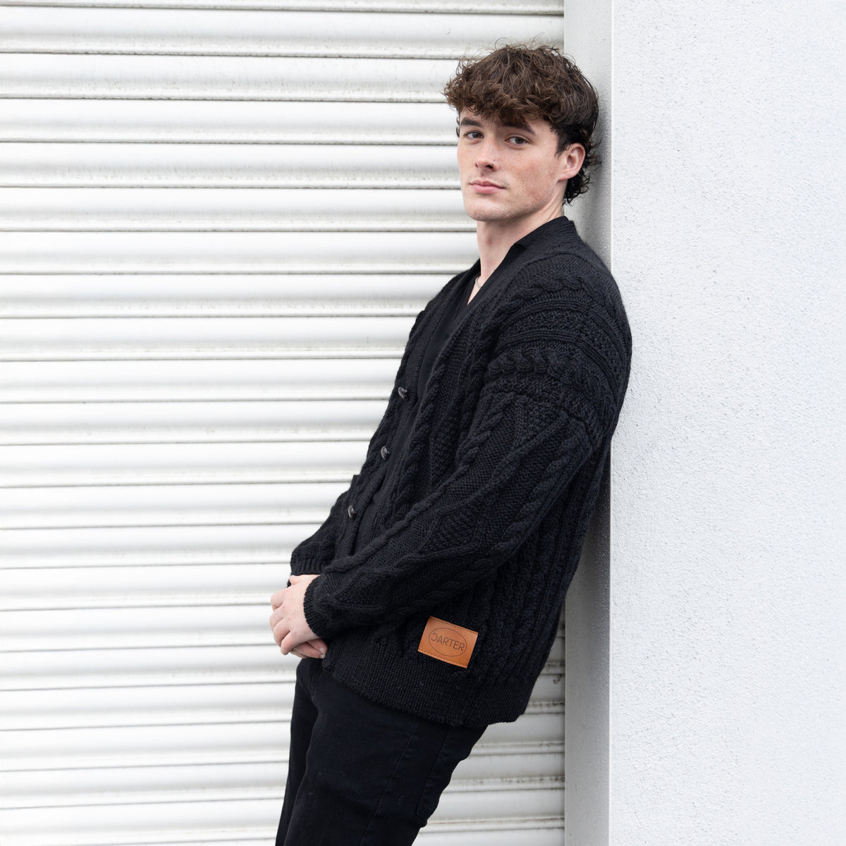 VG111B PURE WOOL ARRAN CARDI IN BLACK
