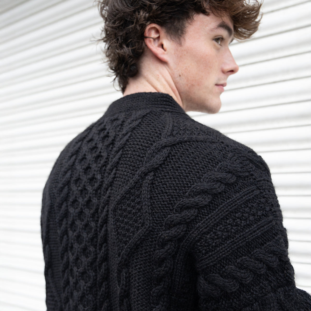VG111B PURE WOOL ARRAN CARDI IN BLACK