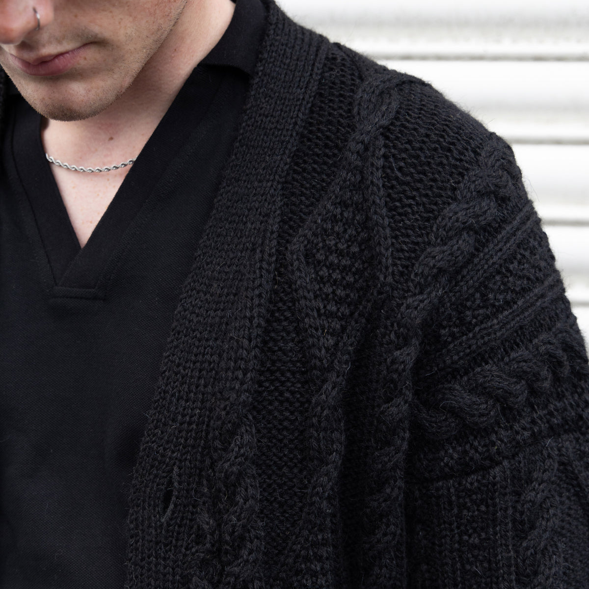VG111B PURE WOOL ARRAN CARDI IN BLACK